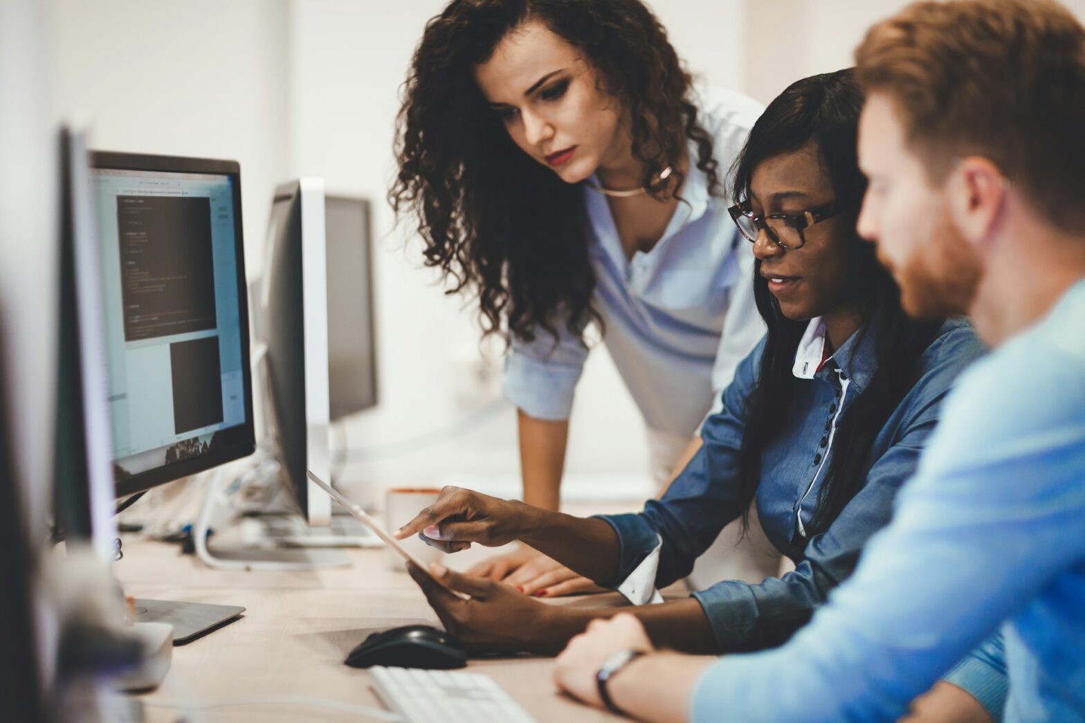 Three person talking to each other